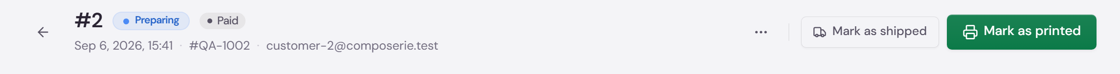 An order header with the status pill next to the order number